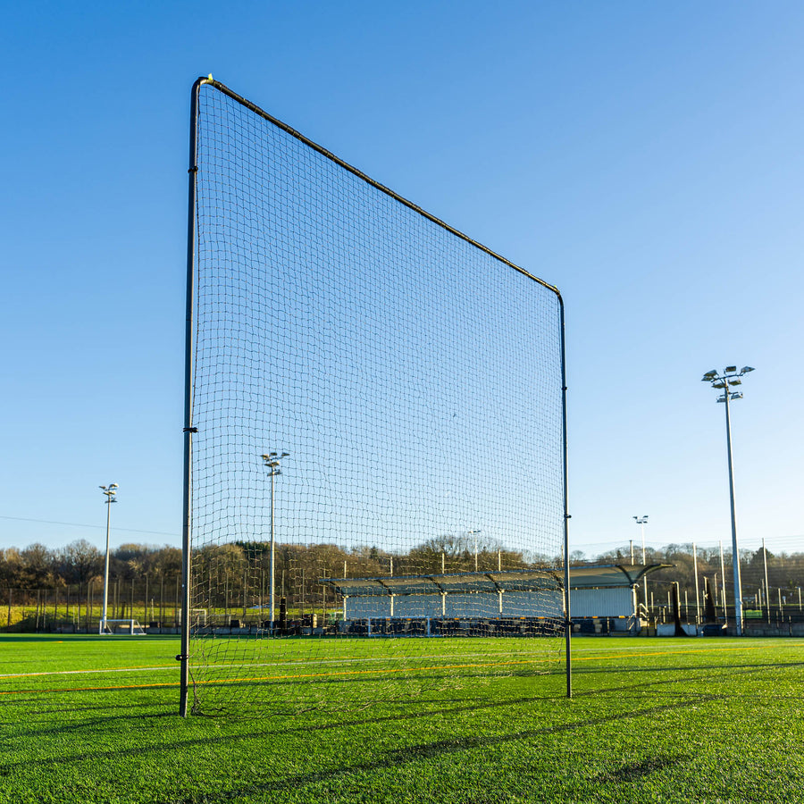 Large black Barrier Net System on a sports field with clear blue sky
