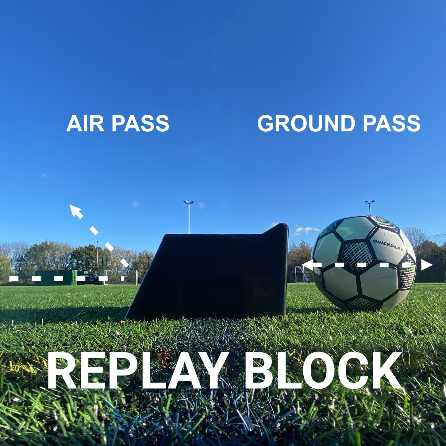 REPLAY Block Dual Angle Rebound Board at ground level beside a soccer ball, with arrows marking an air pass and a ground pass.