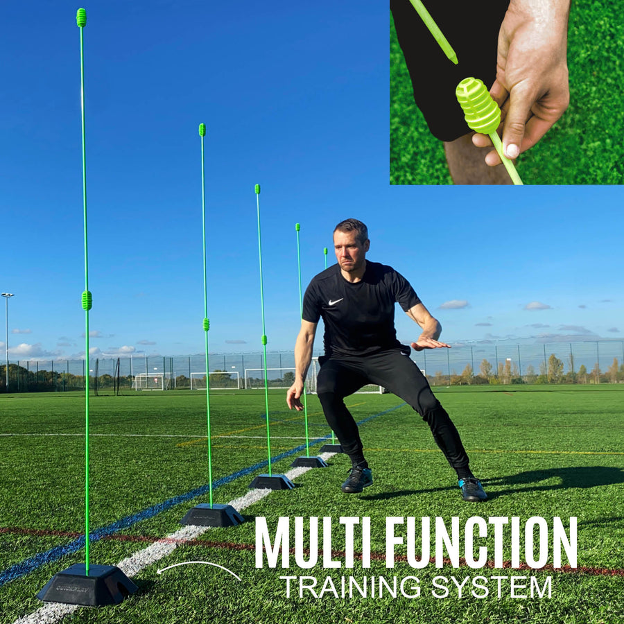 Person using a multi-function training system with green markers on a sports field.