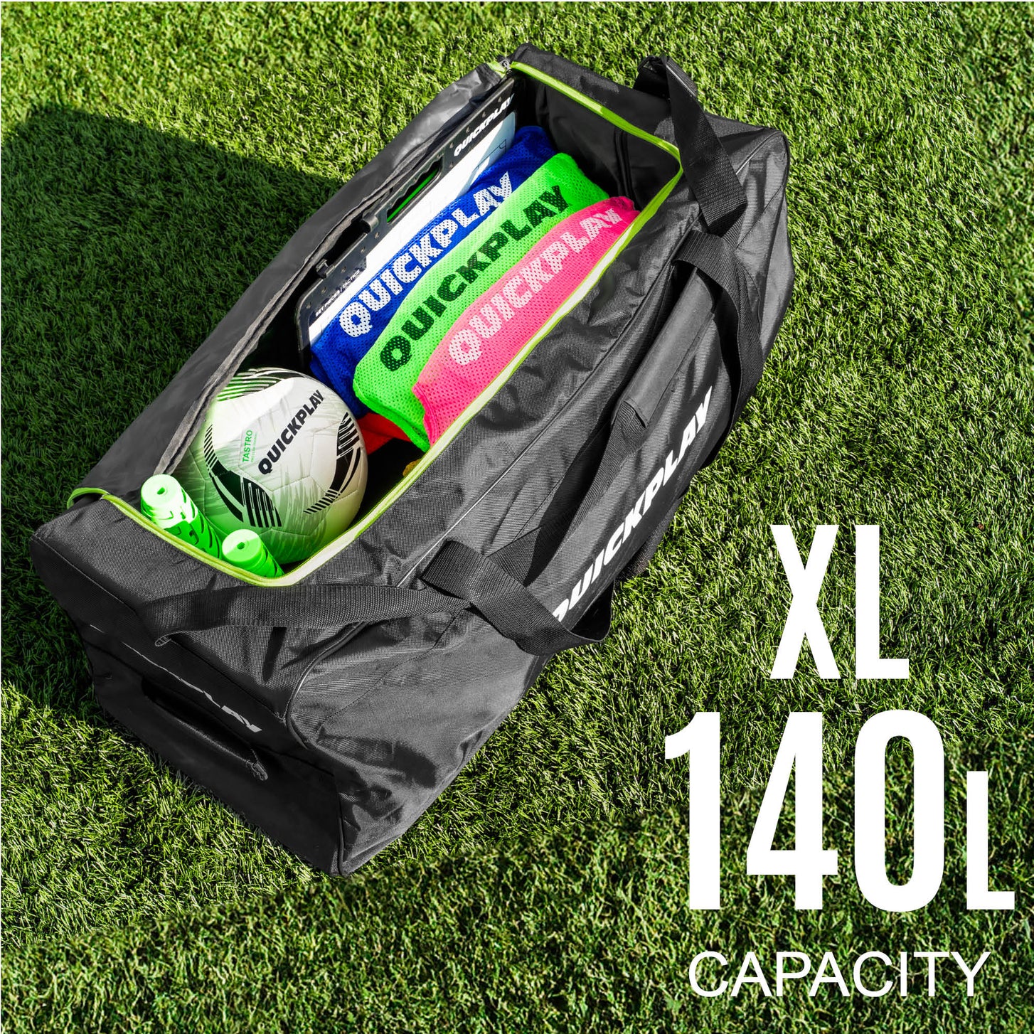 Equipment Bag with Wheels (XL) open on turf, packed with pinnies, a soccer ball and a tactics board, with the text "XXL 140L capacity".