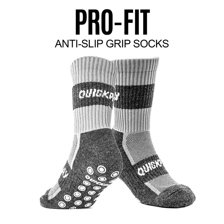 Gray and black socks with QUICKPLAYbranding on a white background, labeled as 'Pro-Fit Anti-Slip Grip Socks'.