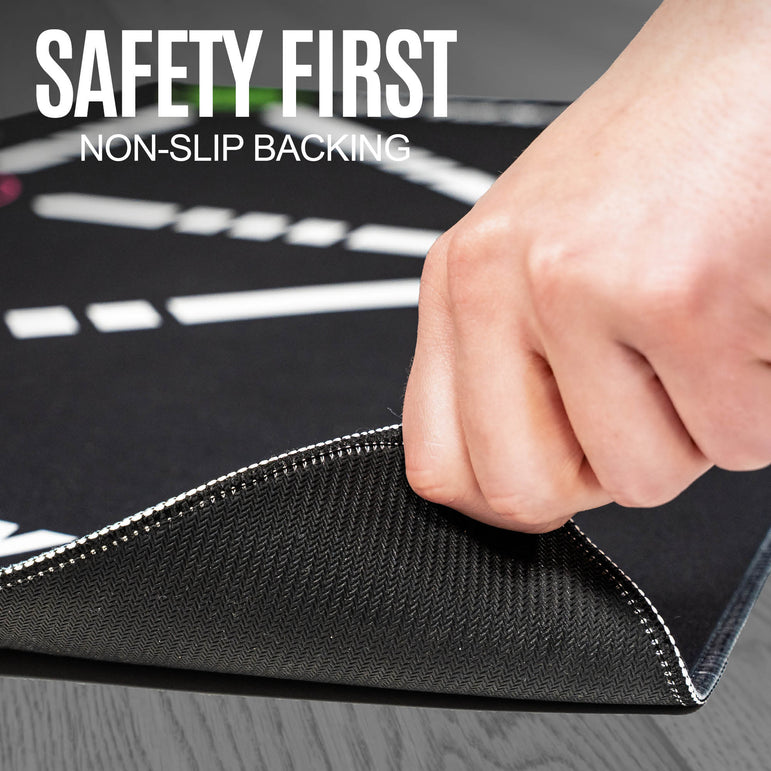 Hand pressing on a ball mastery mat showing the Safety First Non-Slip Backing