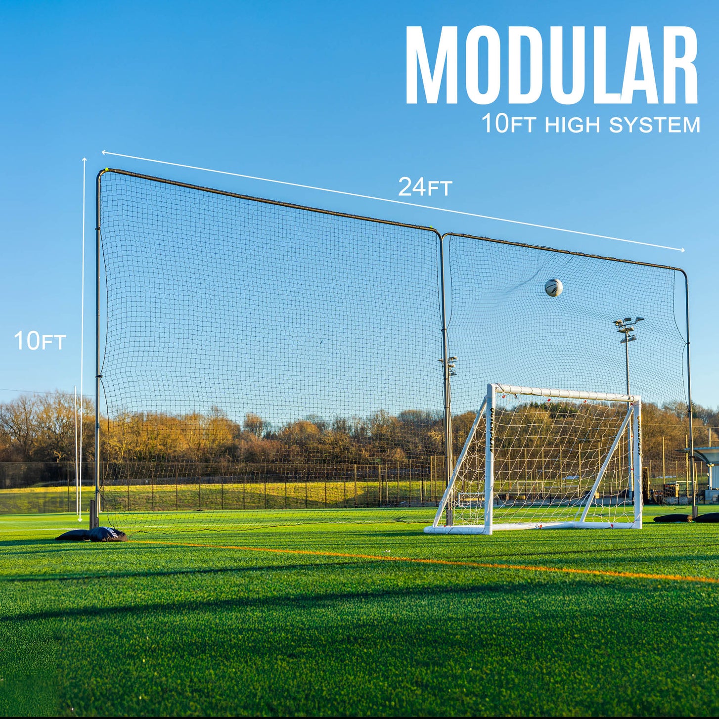 10ft Barrier Net System Freestanding: two panels behind a white goal as a ball hits the net, marked 24ft wide and 10ft high, with the text "Modular".