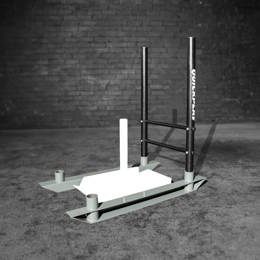 Push Upgrade for Speed Sled: two black upright handles with QUICKPLAY on a gray sled frame, in a dark brick room.