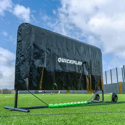 Black training aid with 'Quickplay' branding on a sports field