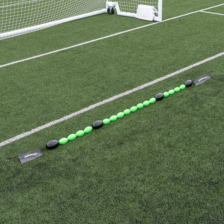 Long line of a green goalkeeper deflection line on grass