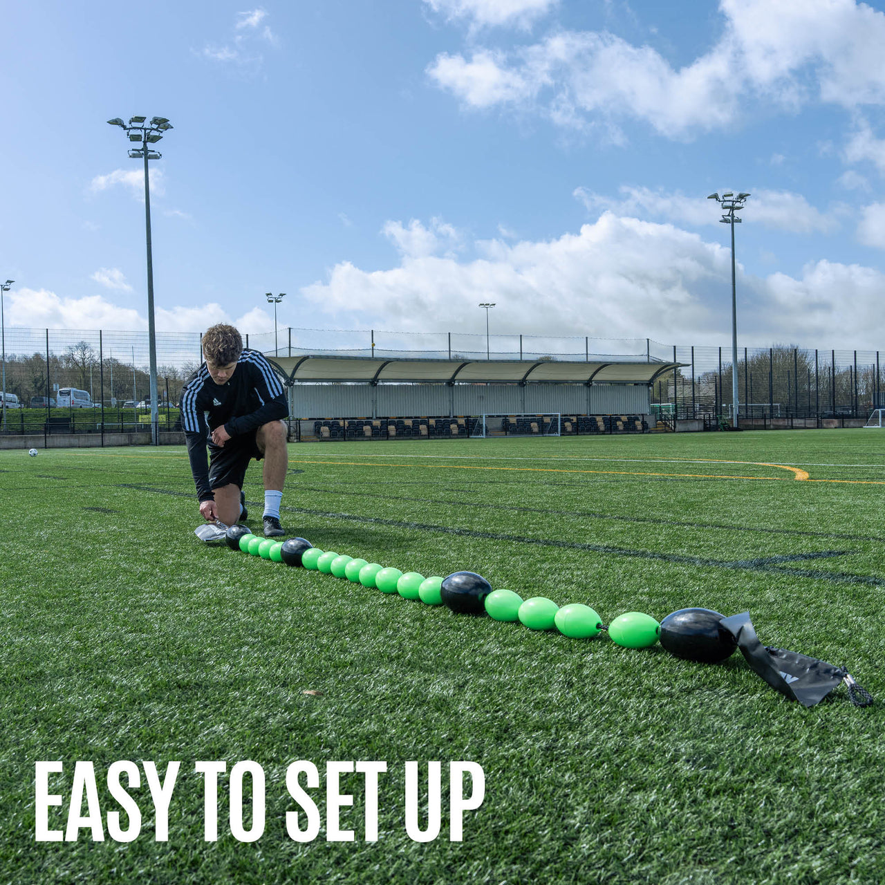 Green and black goalkeeper deflection line training equipment on gras
