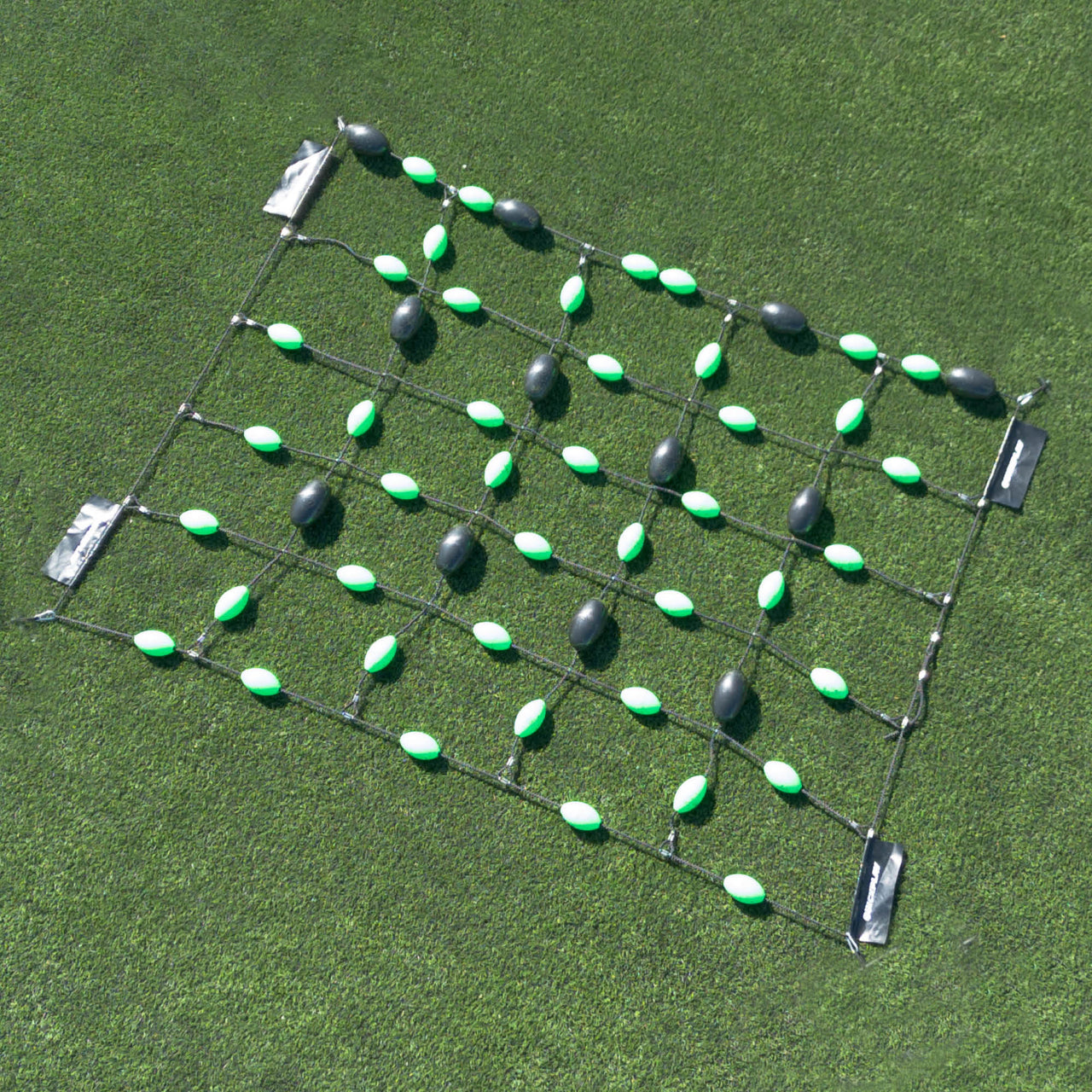 Grid formation with green and black goalkeeper deflection grid on a sports field