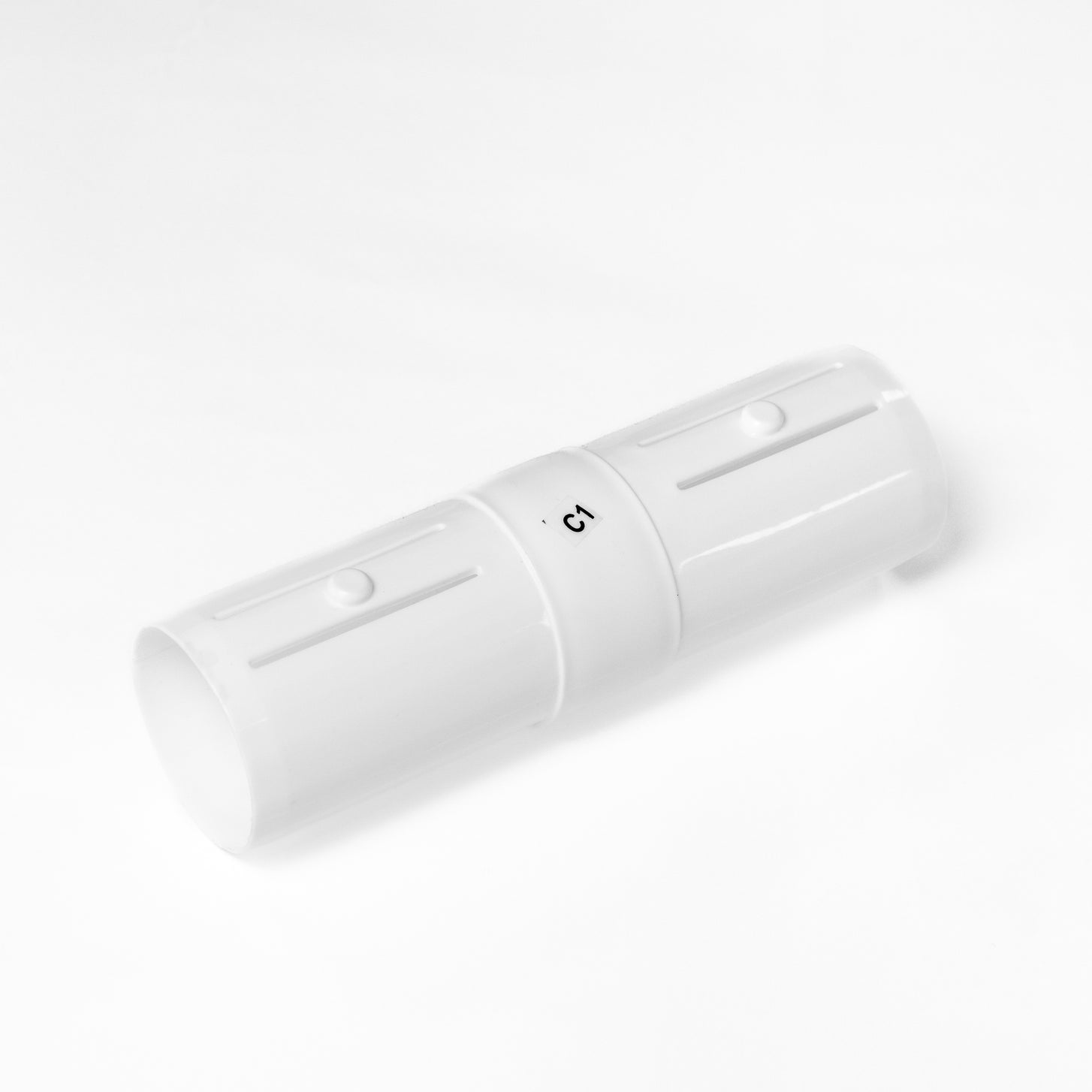 White Q-FOLD C1 connector tube marked "C1" with slotted ends, on a white background.