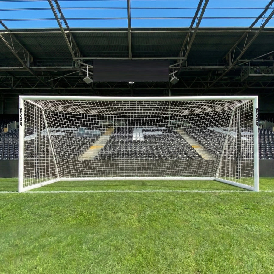 QUICKPLAY PRO ALU Soccer goal on a grass field with stadium seats in the background
