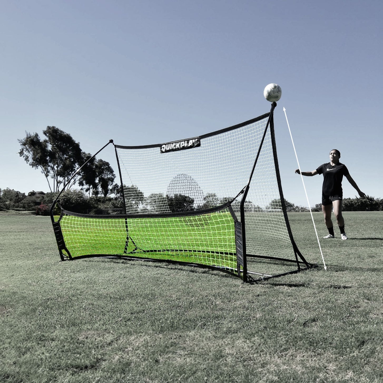TEKKERS Trainer lower net picked out in green on a black and white photo of the rebounder, with a player and ball beside it.