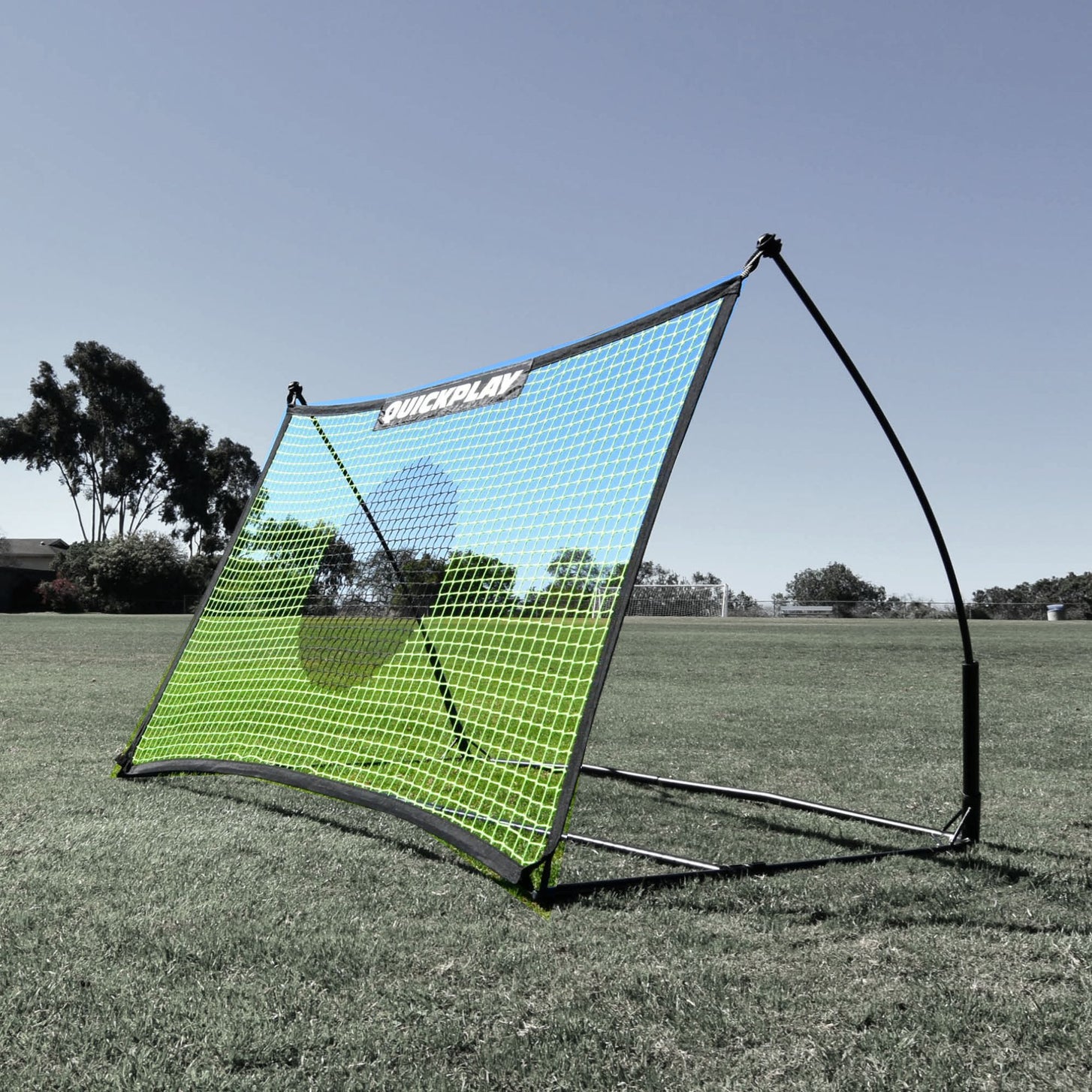 TEKKERS Net 5x3' on its frame: a green rebound net with a blue border and QUICKPLAY label, standing on grass.