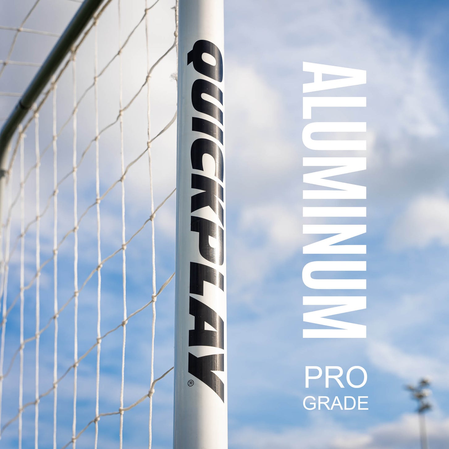 PRO ALU Match60 Futsal Goal 9.8x6.5' close up: the white post printed QUICKPLAY against the sky, with the text "Aluminum, pro grade".