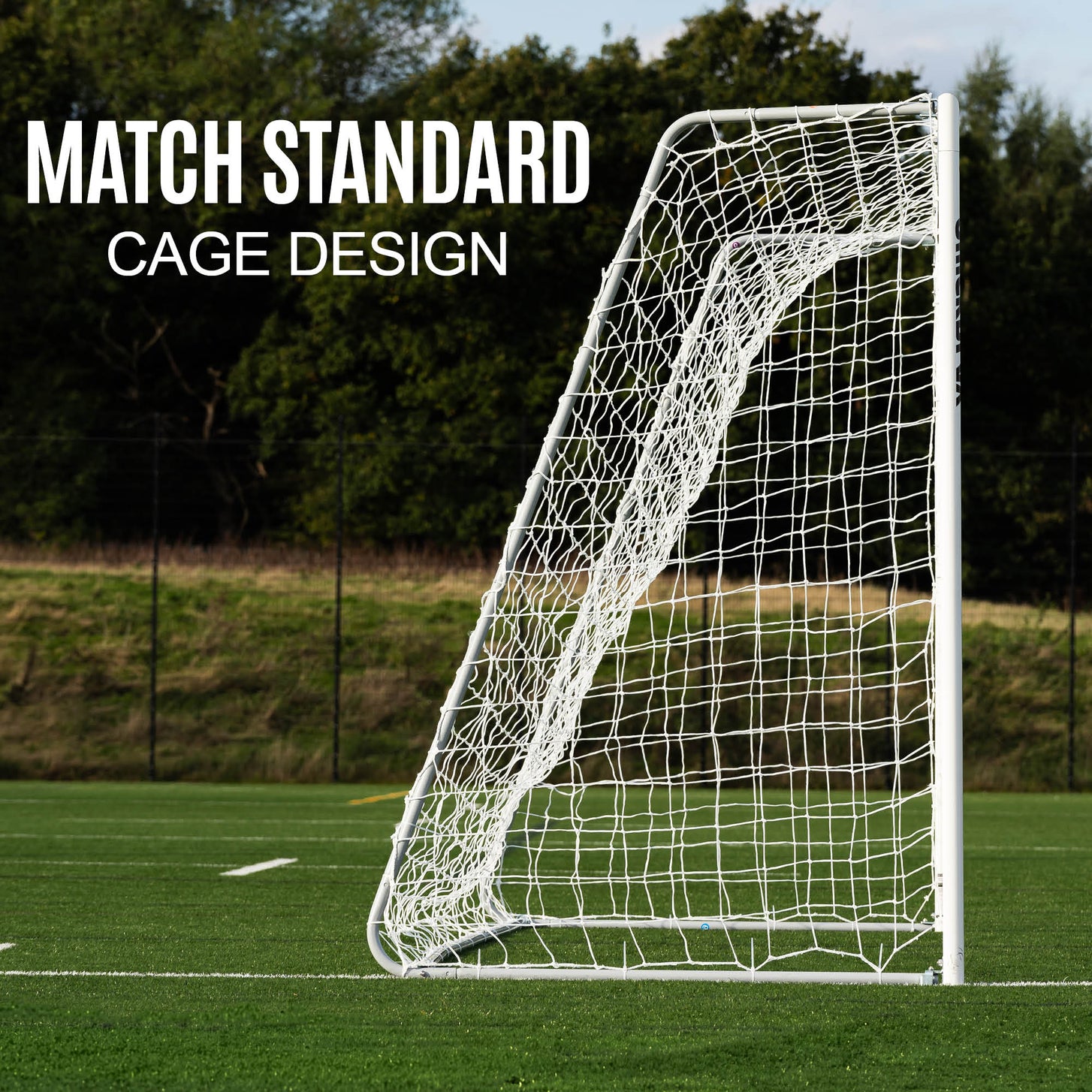 PRO ALU Match60 Futsal Goal 9.8x6.5' seen from the side on an artificial field, showing its net cage, with the text "Match standard cage design".