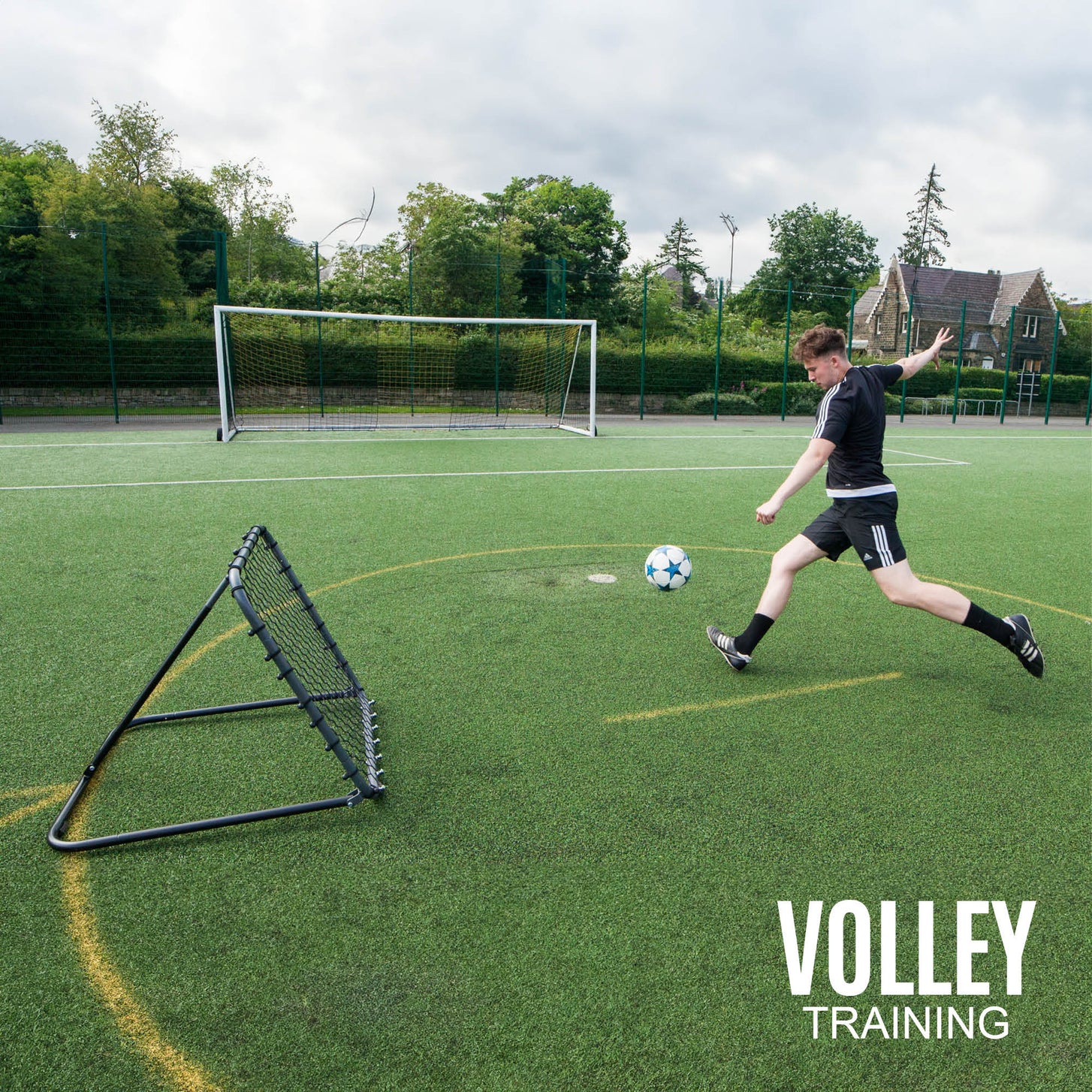 Player striking a soccer ball toward the PRO Rebounder 3x3' set at a steep angle, with the text "Volley training".
