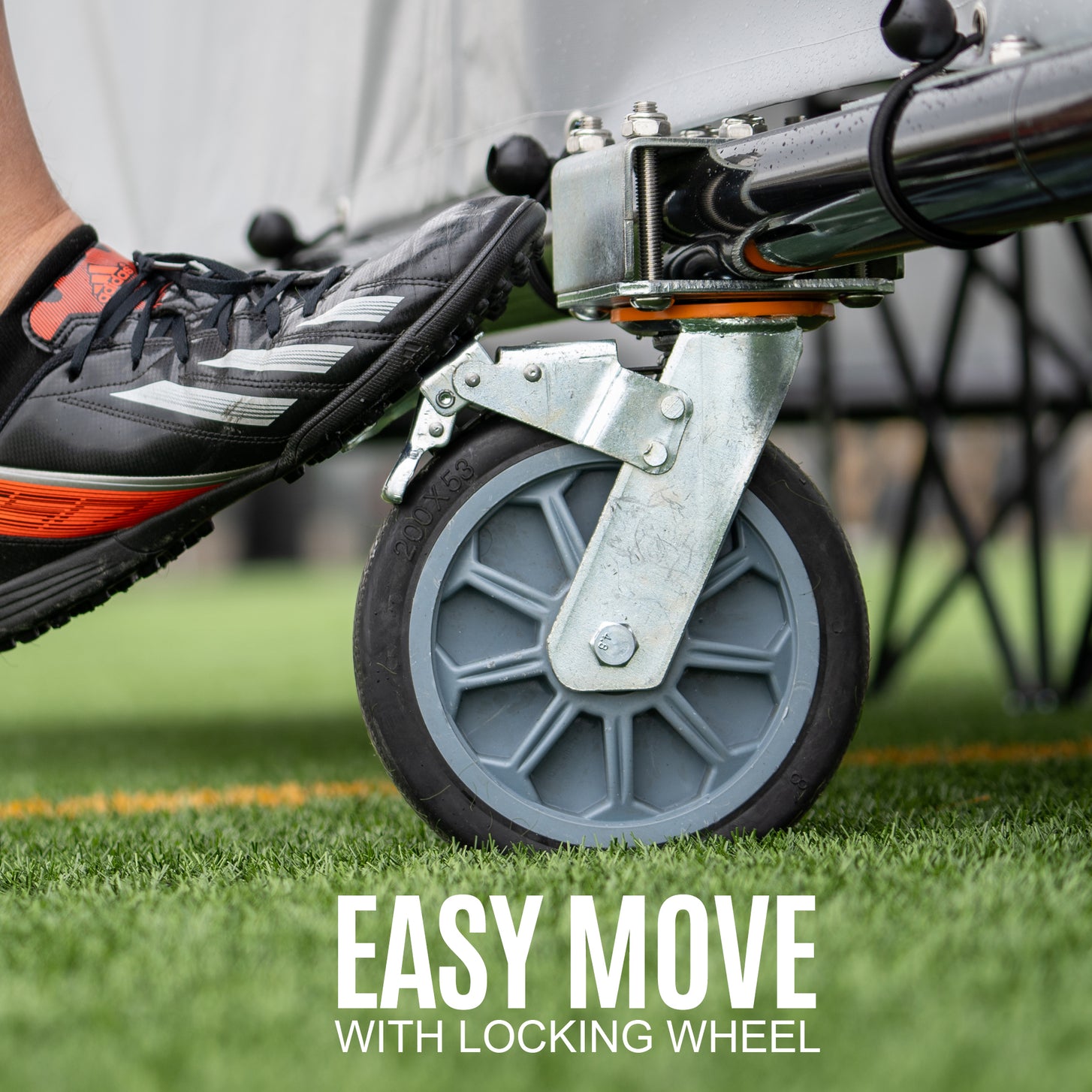 Cleat pressing the wheel lock on the PRO ALU Club Shelter 16x6', with the text "Easy move with locking wheel".