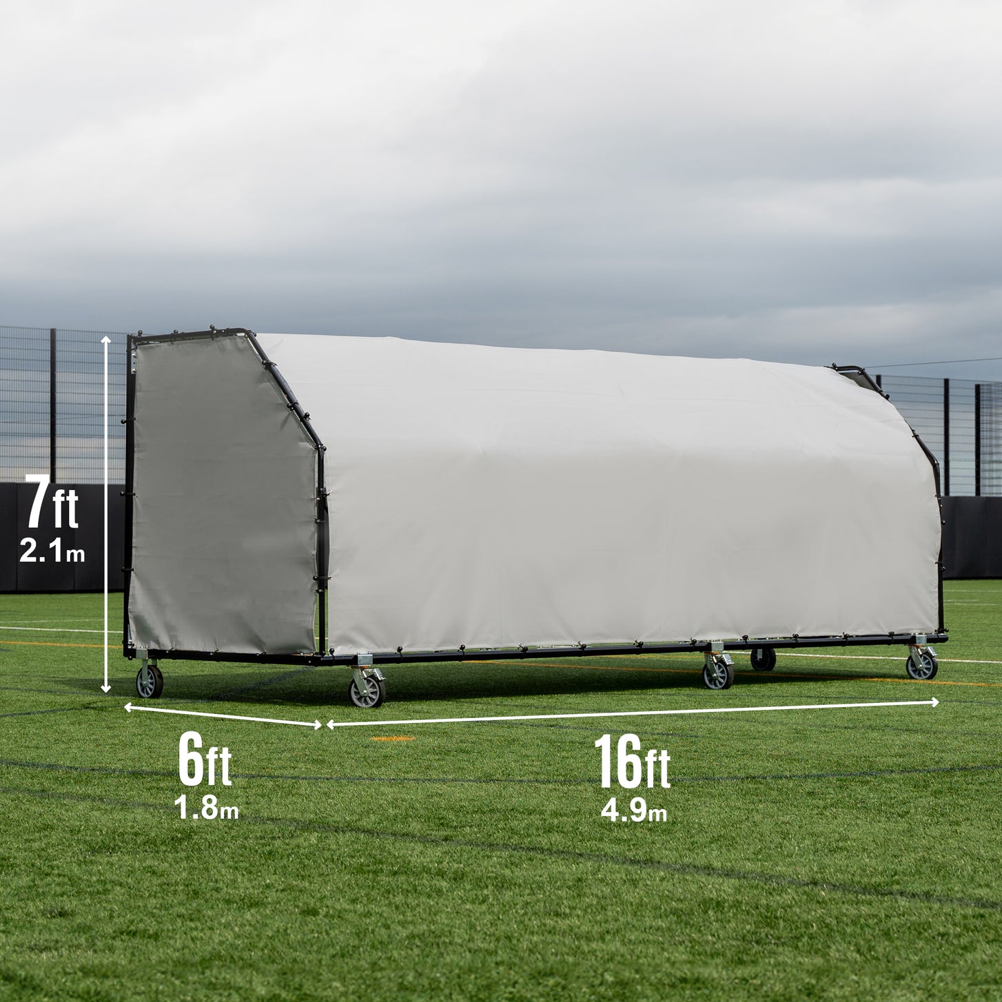 PRO ALU Club Shelter 16x6' seen from the back on an artificial field, marked 7ft high, 6ft deep and 16ft wide.