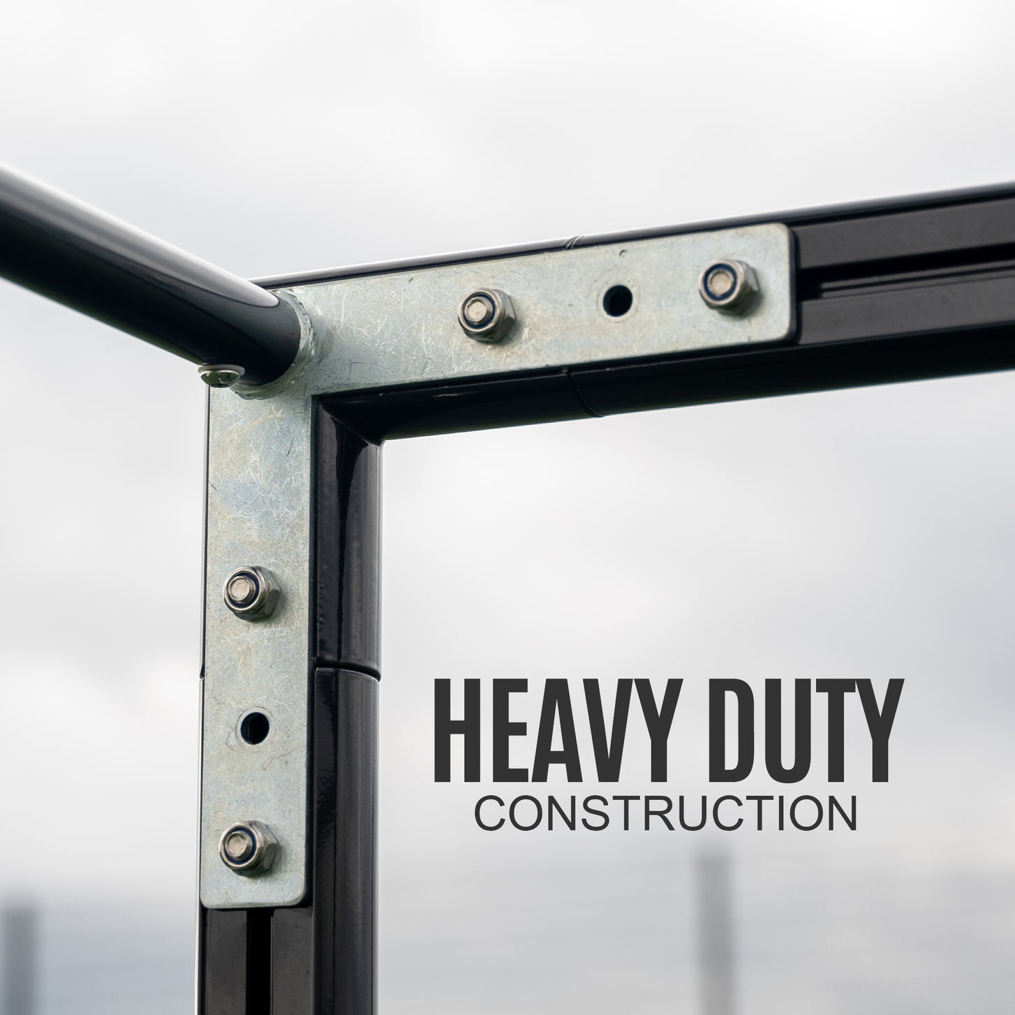 PRO ALU Club Shelter 16x6' frame corner close up with a bolted metal bracket, with the text "Heavy duty construction".