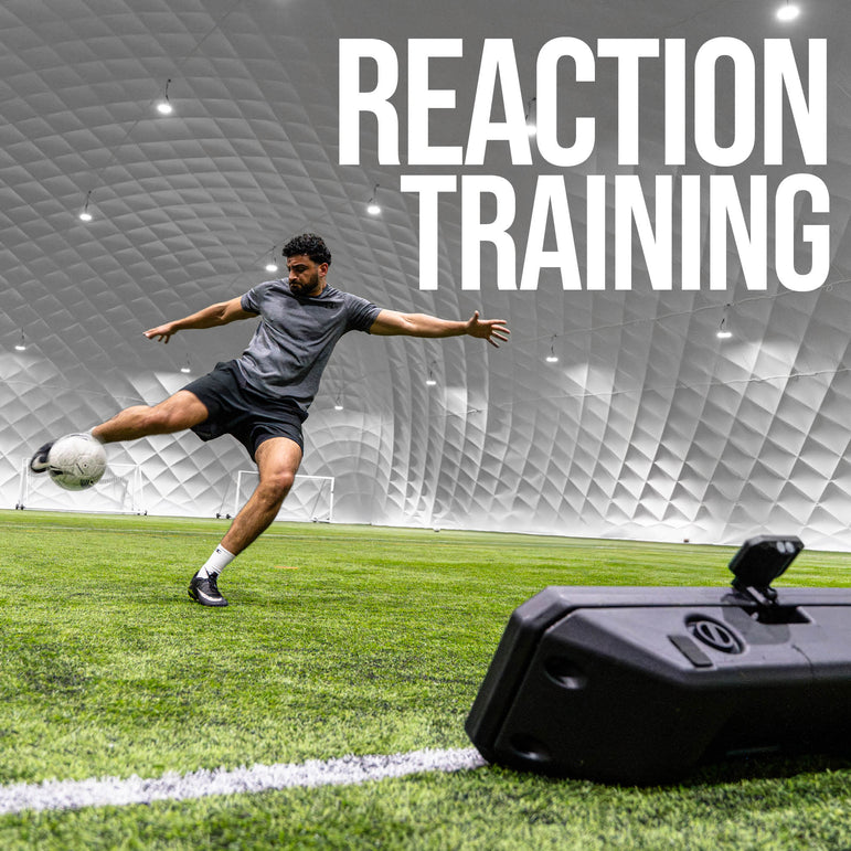 Person kicking a soccer ball on a sports field with 'REACTION TRAINING' text above and an RXTR Pro Coach in front of him