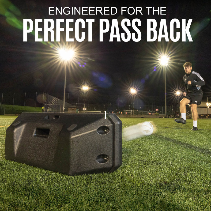 Black sports rebound board on a grass field with a person and text about perfect pass back