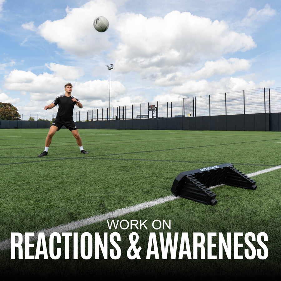 Person practicing soccer drills with a ball on a sports field, text 'Work on Reactions & Awareness' displayed.