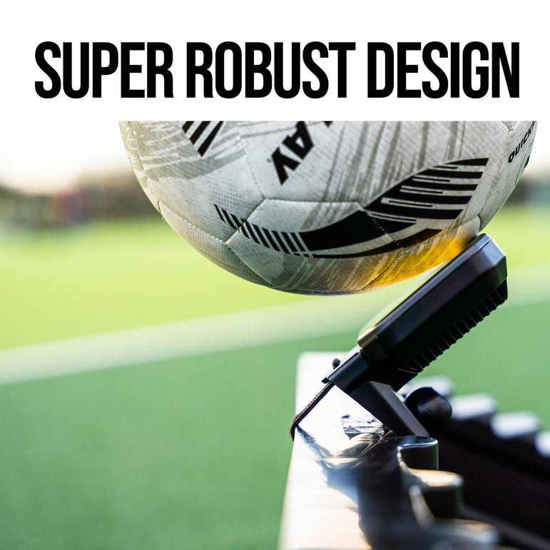 Soccer ball being kicked against an RXTR with 'Super Robust Design' text above it, on a blurred sports field background.