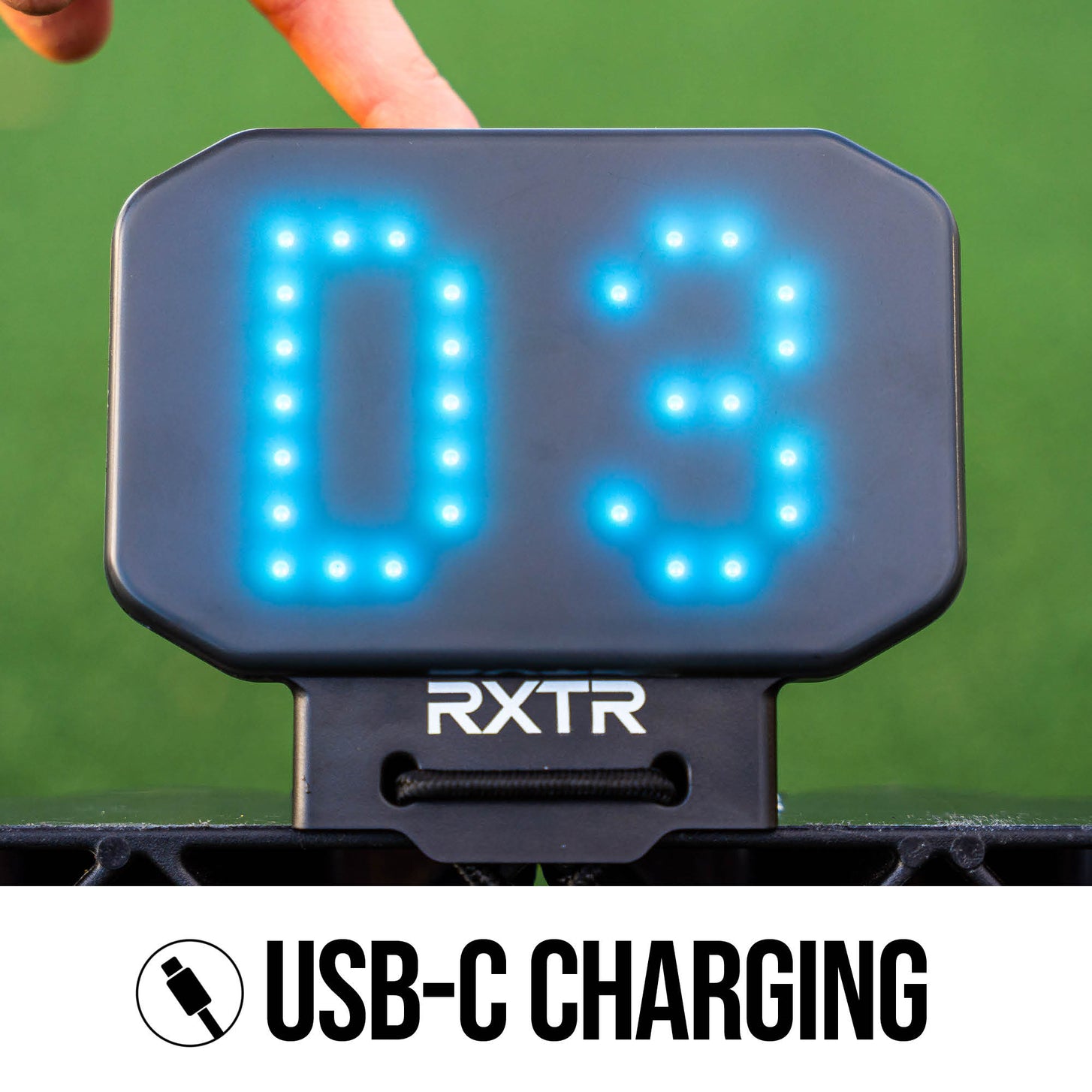 RXTR display with 'D3' and 'RXTR' branding, being used by a person against a green background.