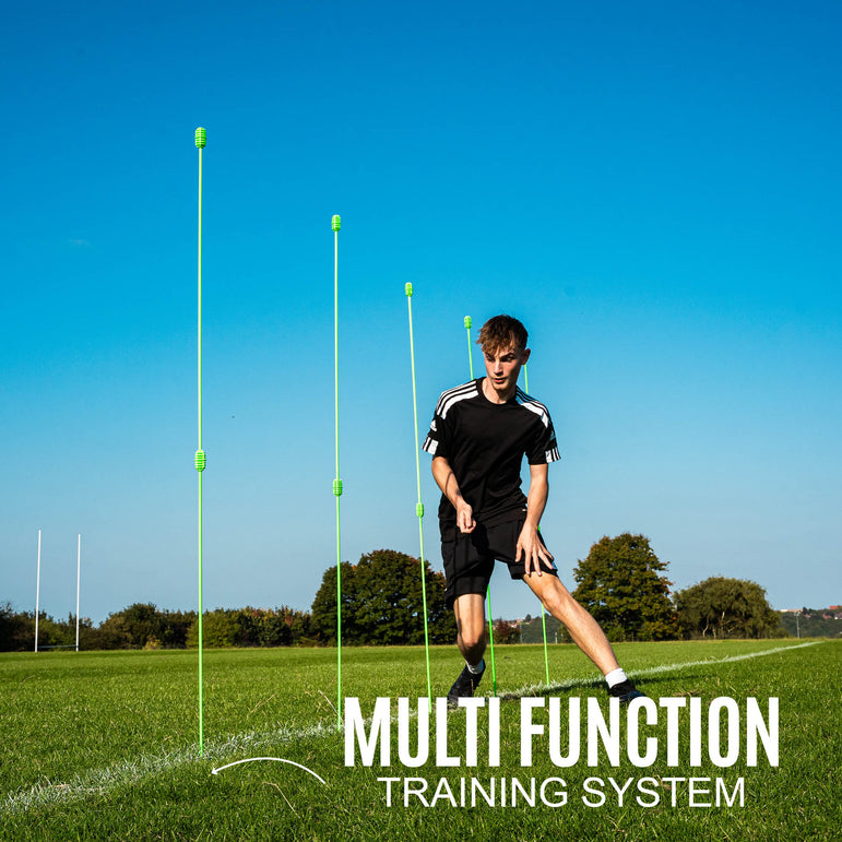 Person using a QUICKPLAY multi-function training system on a grass field with clear blue sky