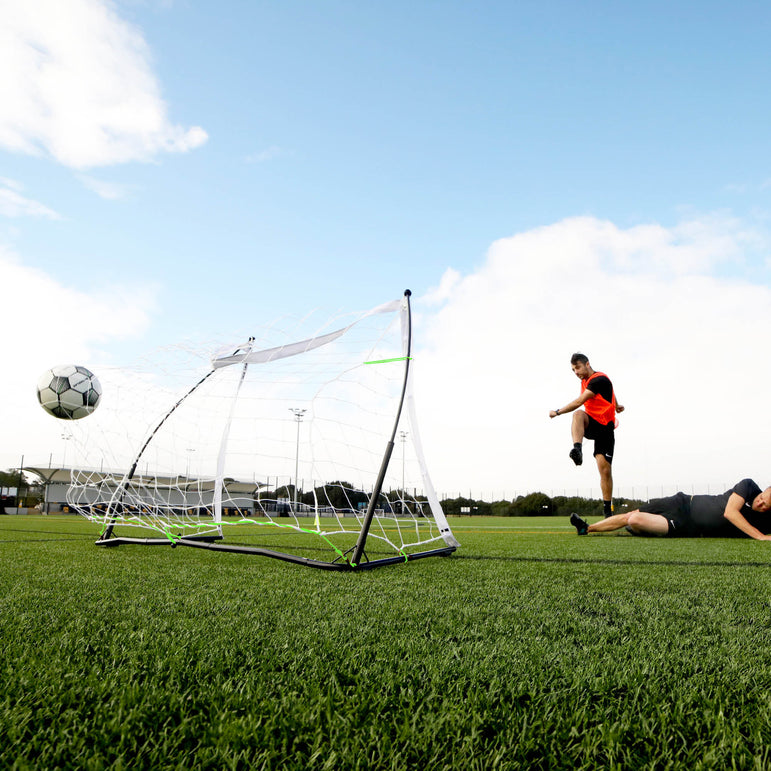 Action shot of a player scoring a goal into a Kickster Elite goal