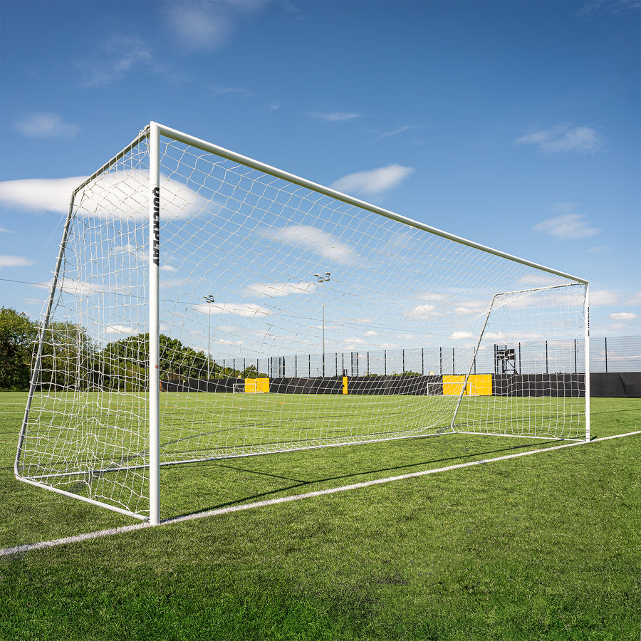 QUICKPLAY Pro Alu Soccer goal on a grass field with a clear blue sky