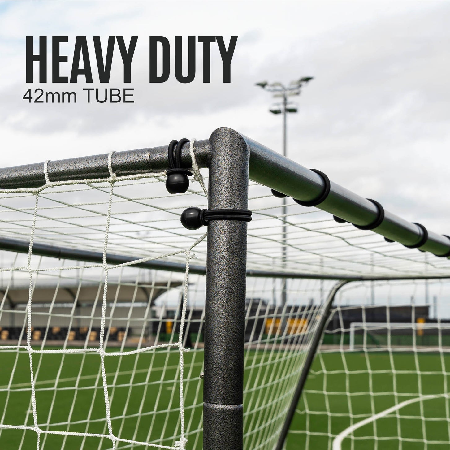 GS Series Soccer Goal 6x4' top corner close up, with black ball ties on the net, and the text "Heavy duty, 42mm tube".