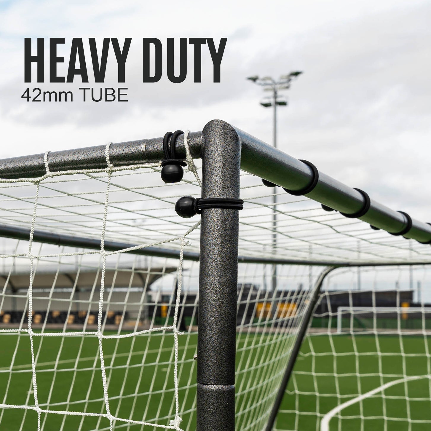 GS Series Soccer Goal 8x5' top corner close up, with black ball ties holding the net, and the text "Heavy duty, 42mm tube".