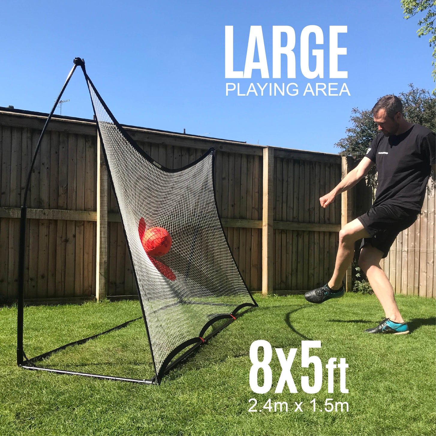 SPOT Soccer Rebounder 8x5' in a backyard as a man strikes a ball into the red target, with "Large playing area" and "8x5ft, 2.4m x 1.5m".