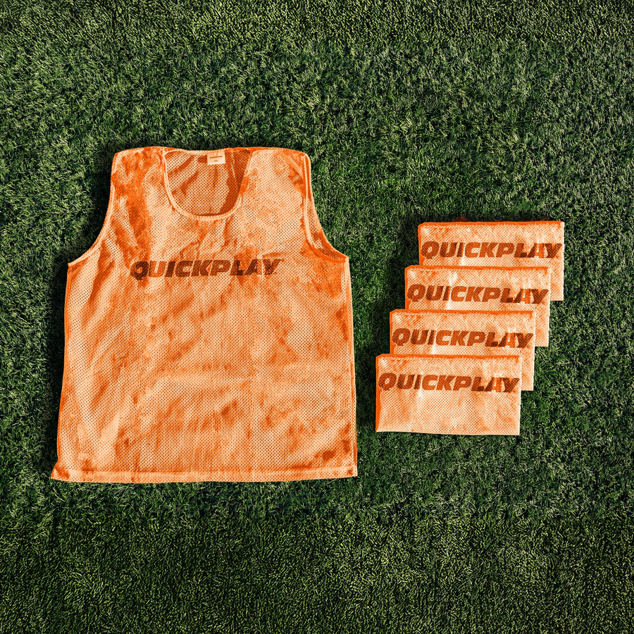 An orange QUICKPLAY breathable mesh training vest.