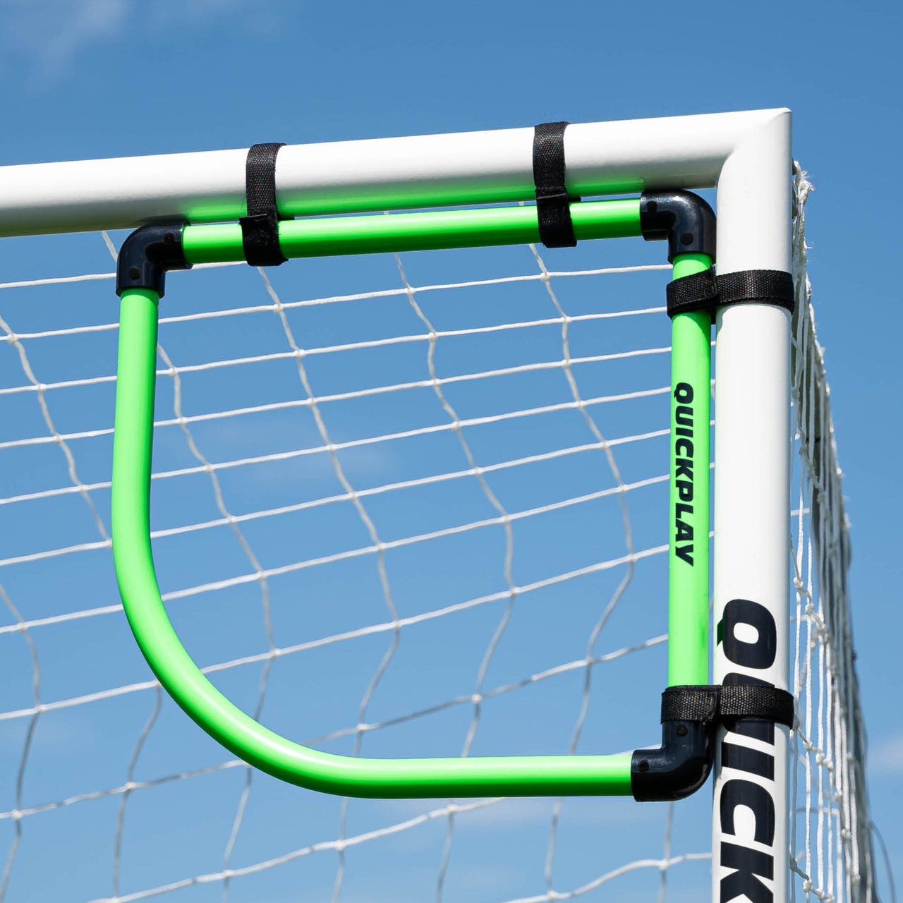 Green QuickPlay corner target with a clear blue sky background