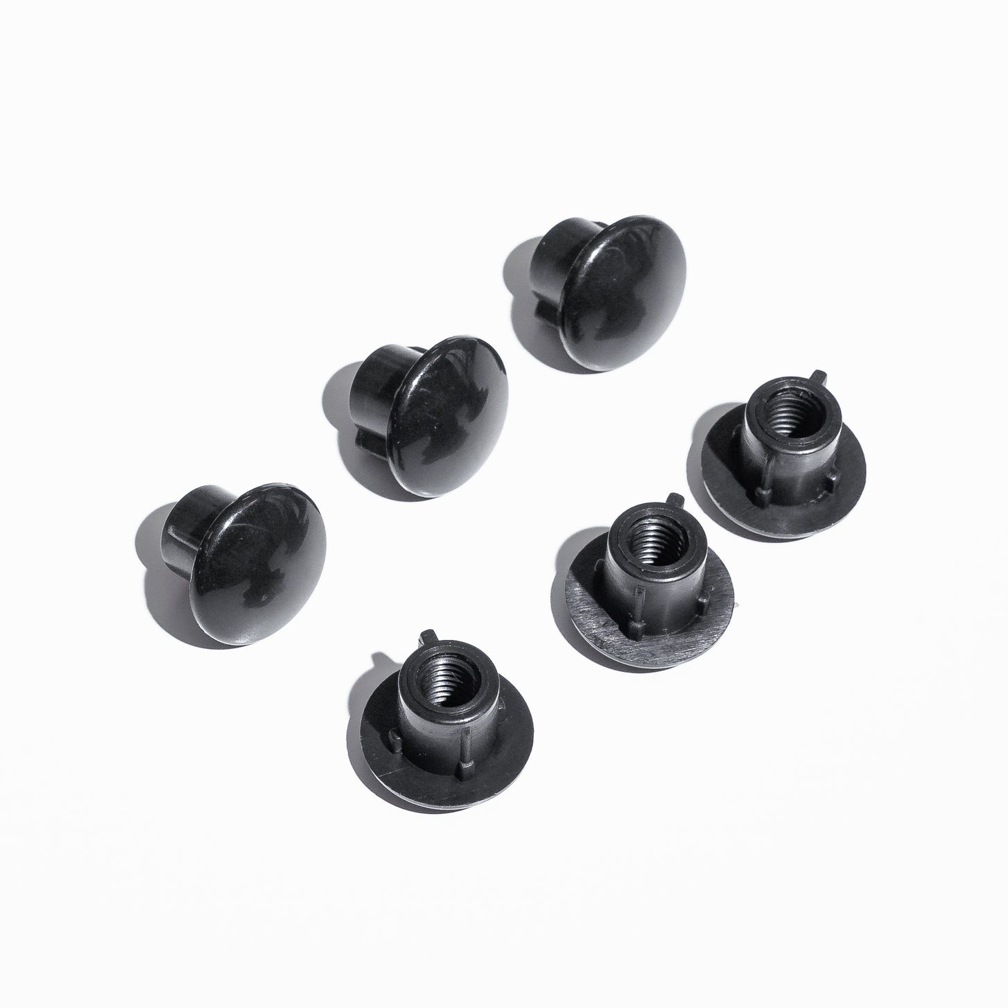 Three black domed PRO Bench pole caps and three black threaded inserts laid out on a white background.