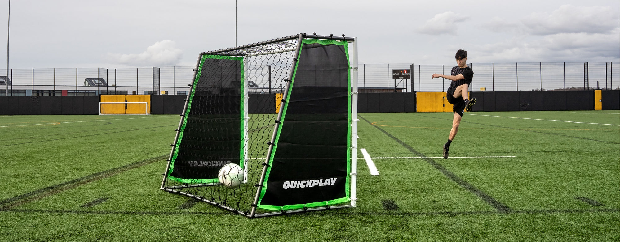 a player practicing on a Tekkers GS Trainer 3 in 1 goal and rebounder.