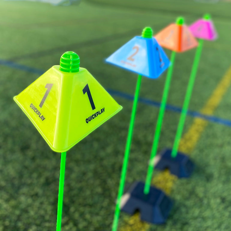 Colorful cognitive markers with numbers on a grassy field, branded QUICKPLAY
