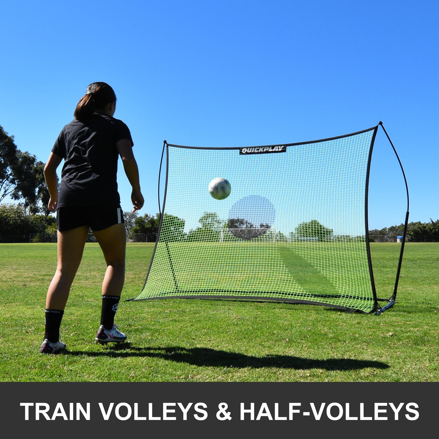 TEKKERS Rebounder Net XL 8x6': player waits for a ball bouncing off the net, with the text "Train volleys & half-volleys"